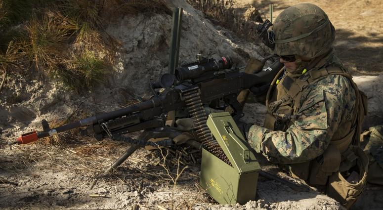 Marine Corps Pfc. Elias Cruz, a combat engineer with 8th Engineer Support Battalion, 2nd Marine Logistics Group, loads 7.62 mm ammunition into a M240B machine gun during counter mobility and survivability training aboard Camp Lejeune, N.C., Jan. 31, 2018. machine gun