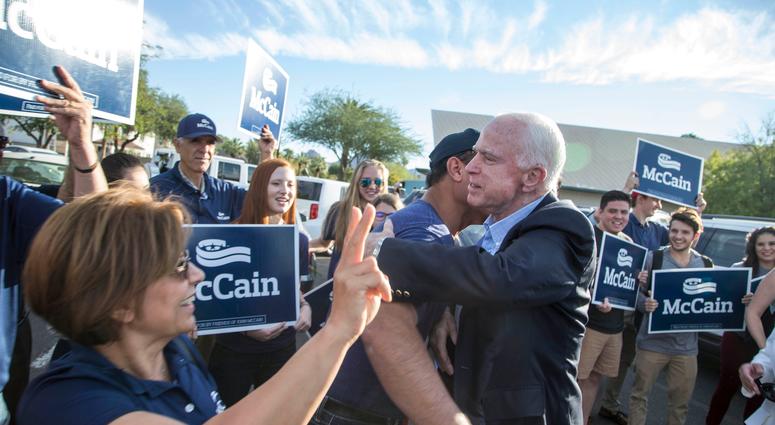 Nov 8, 2016; Phoenix, AZ, USA; Arizona senator John McCain and his wife Cindy McCain greet their supporters before he talks to the media after casting their ballots in the presidential election at Mountain View Christian Church.