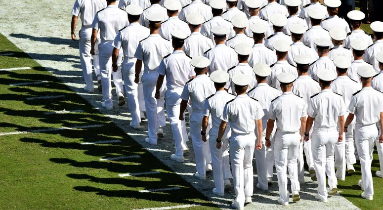The United States Naval Academy Brigade of Midshipmen march into the stadium for pregame ceremonies before the game between the Navy Midshipmen and the Notre Dame Fighting Irish at EverBank Field.