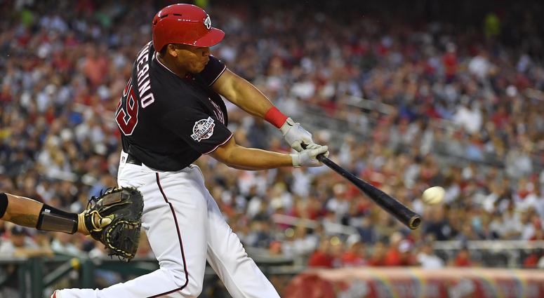 Washington Nationals catcher Pedro Severino (29) hits an RBI double against the New York Yankees during the second inning at Nationals Park.