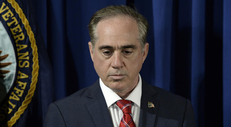 Secretary of Veterans Affairs David Shulkin listens to President Trump before signing an Executive Order on Improving Accountability and Whistleblower Protection at the Department of Veterans Affairs in Washington, DC, April 27, 2017.