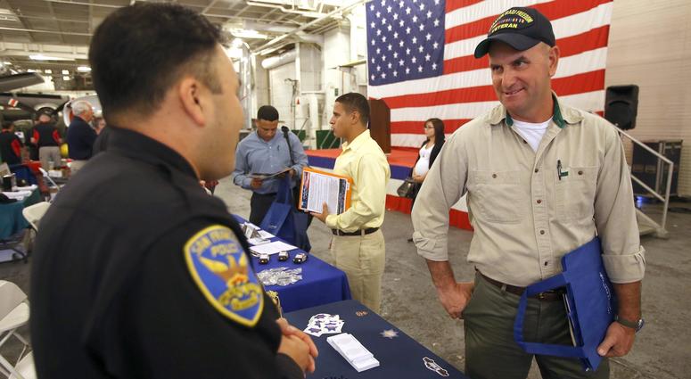 Veterans from different branches of the military networked at a job fair event in the hopes of finding potential employment.