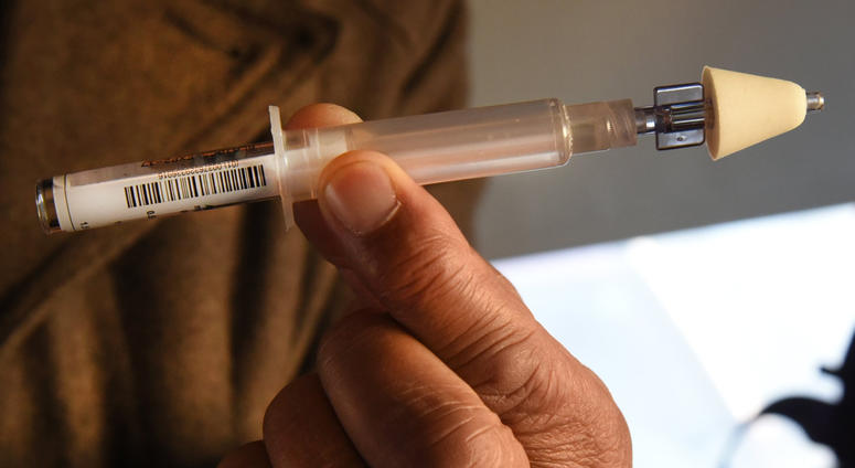 Thomas Clemons offers instructions on how to use naloxone, also called Narcan, to reverse a heroin overdoses to addicts who visit a Baltimore City needle exchange van.