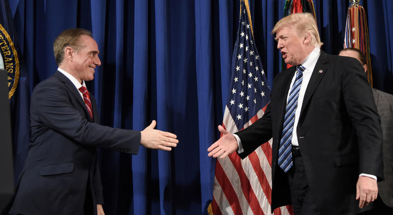 Donald Trump checks hands with Secretary of Veterans Affairs David Shulkin before giving remarks and signing an Executive Order on Improving Accountability and Whistleblower Protection.