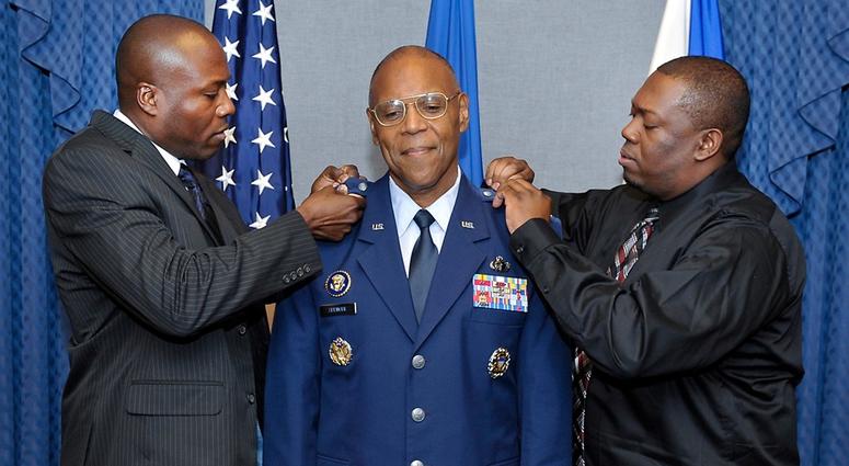 Gen. Larry Spencers sons Larry and Derrick pin new rank to his uniform during a promotion ceremony at the Pentagon, July 27, 2012. Spencer will become the new Air Force Vice Chief of Staff.