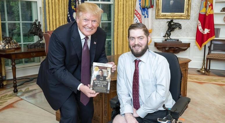 President Donald Trump with Marine veteran Sgt. John Peck, who lost all 4 limbs in an IED in Afghanistan and has since had a double arm transplant