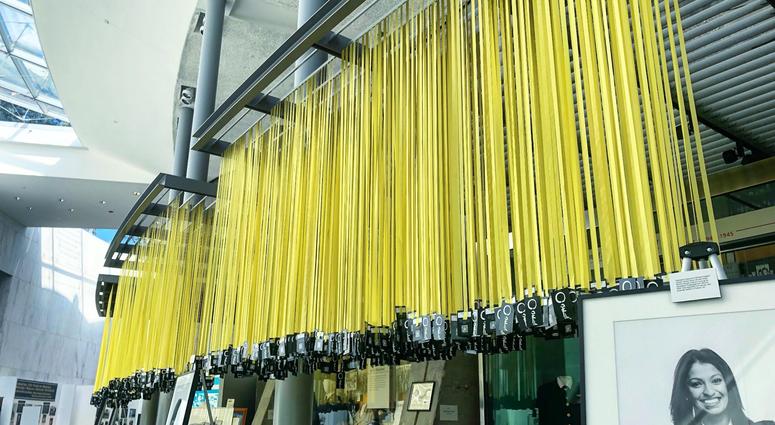 Yellow ribbons for each of the 6,964 service members killed since 9/11 hang in the Women In Military Service For America Memorial in Arlington National Cemetery as part of Mindful Memorial Day, alongside artifacts, photos and art of women veterans. MindfulMemorialDay3