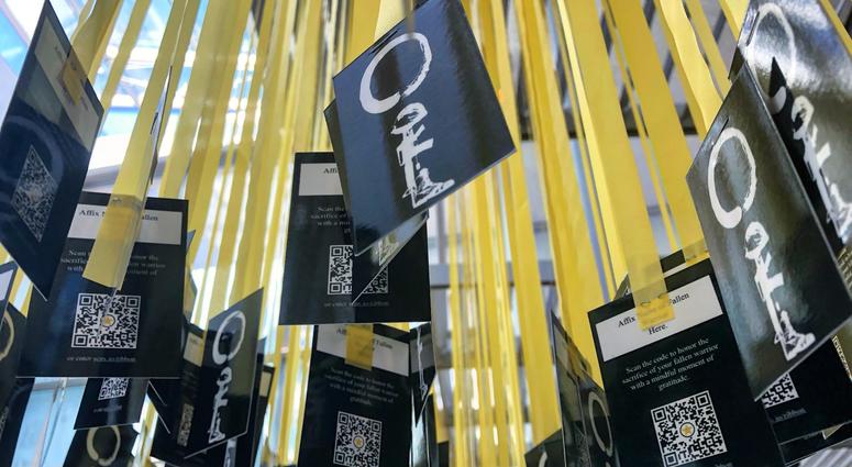 6,964 yellow ribbons hang in the women's memorial at Arlington National Cemetery -- one for each service member killed since 9/11/ MindfulMemorialDay6