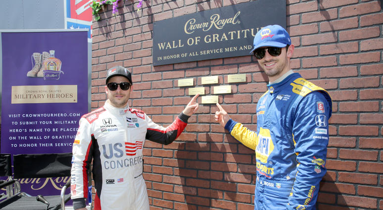 Verizon IndyCar Series drivers Marco Andretti and Alexander Rossi pictured with the Wall of Gratitude during Crown Royal and Andretti Autosport team up to honor military heroes on April 13, 2018 in Long Beach, California.