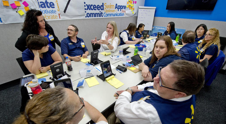 In a classroom inside the Wal-Mart Supercenter in Shawnee, facilitator Nichole Umscheid, standing left, talks with students in her Wal-Mart Academy class. walmart