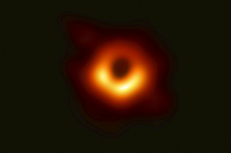 This image released Wednesday, April 10, 2019, by Event Horizon Telescope shows a black hole. Scientists revealed the first image ever made of a black hole after assembling data gathered by a network of radio telescopes around the world. (Event Horizon Te