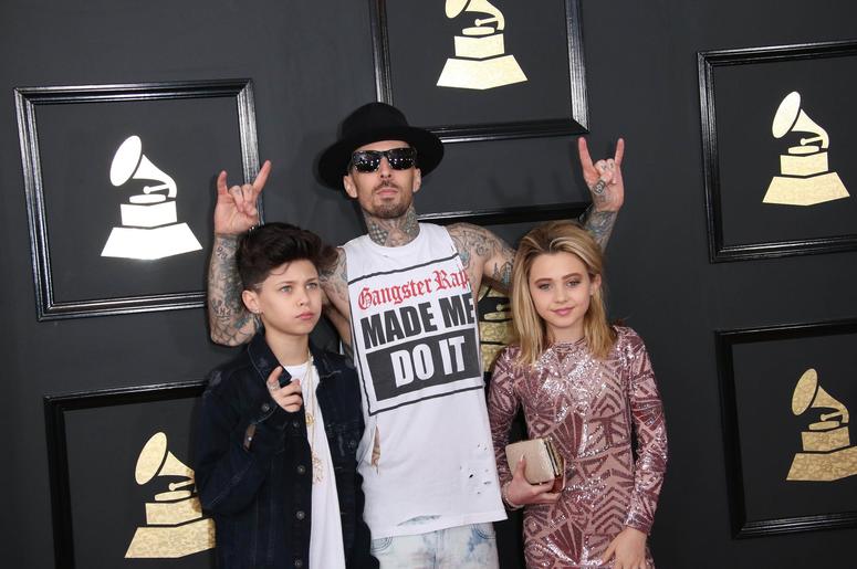 Travis Barker, center, arrives at the 59th Annual Grammy Awards Travis Barker, center, arrives at the 59th Annual Grammy Awards