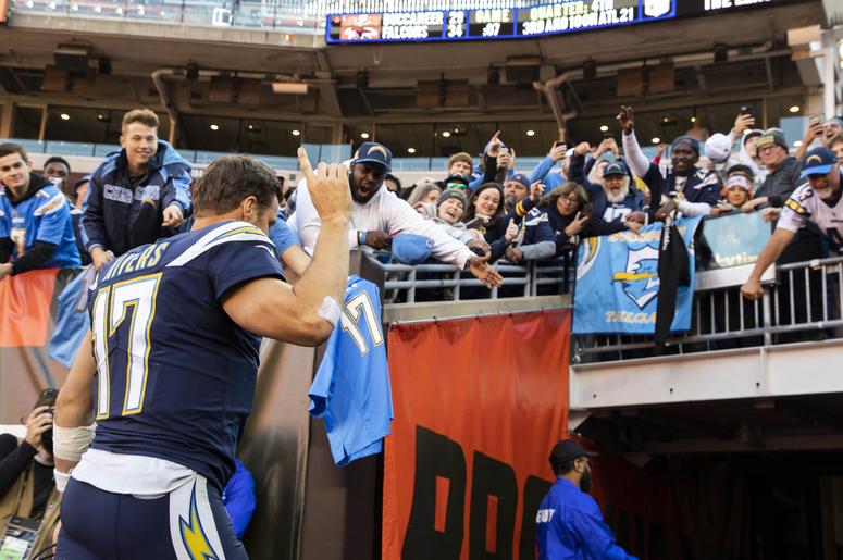 Oct 14, 2018; Cleveland, OH, USA; Los Angeles Chargers quarterback Philip Rivers (17) waves to fans as he leaves the field after the game against the Cleveland Browns at FirstEnergy Stadium. The Chargers won 38-14. Mandatory Credit: Scott R. Galvin-USA TO NFL: Los Angeles Chargers at Cleveland Browns