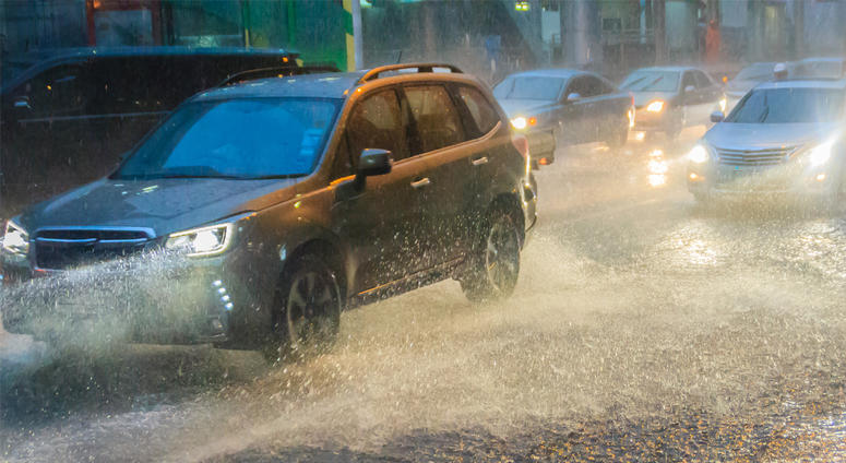 Driving car through the heavy hail and rain Driving car through the heavy hail and rain
