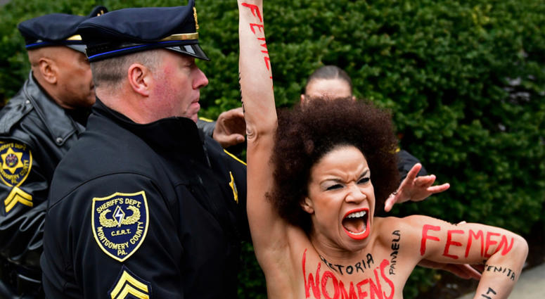 AP18099470295393 ADDS ID OF WOMAN - Actress Nicolle Rochelle, who appeared on several episodes of "The Cosby Show," is detained as Bill Cosby arrives for his sexual assault trial at the Montgomery County Courthouse, Monday, April 9, 2018, in Norristown, Pa. Rochelle of Li