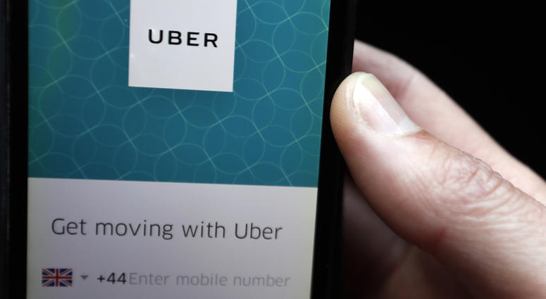 AP18176386643930 In this Friday, Sept. 22, 2017 file photo, an Uber App is displayed on a phone in London. Uber is beginning its court case to remain on the streets of London, arguing that the ride-hailing app has made significant changes since a regulator refused to rene