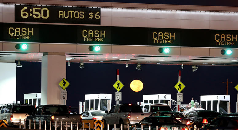 The moon sets as traffic backs up at the San Francisco-Oakland Bay Bridge toll plaza while commuters make their way into San Francisco on the first day of the (Bay Area Rapid Transit) BART strike on October 18, 2013 in Oakland, California. The moon sets as traffic backs up at the San Francisco-Oakland Bay Bridge toll plaza while commuters make their way into San Francisco on the first day of the (Bay Area Rapid Transit) BART strike on October 18, 2013 in Oakland, California.