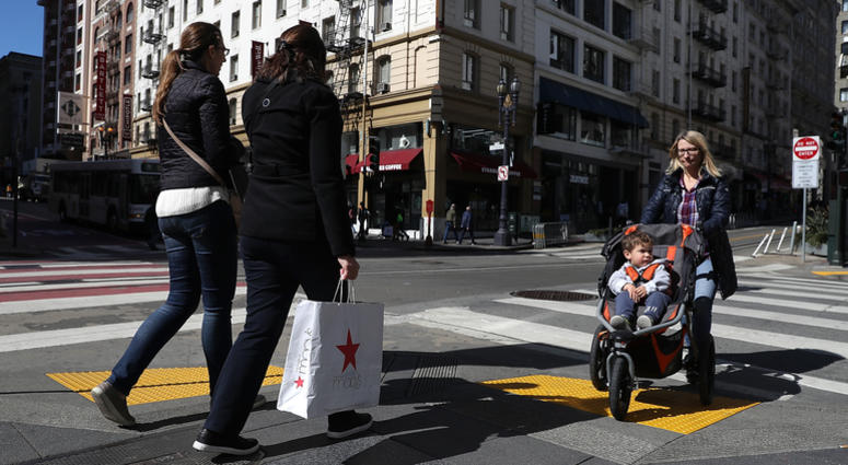 A shopper carries a shopping bag while walking in the Union Square district on February 27, 2018 in San Francisco, California. A shopper carries a shopping bag while walking in the Union Square district on February 27, 2018 in San Francisco, California.