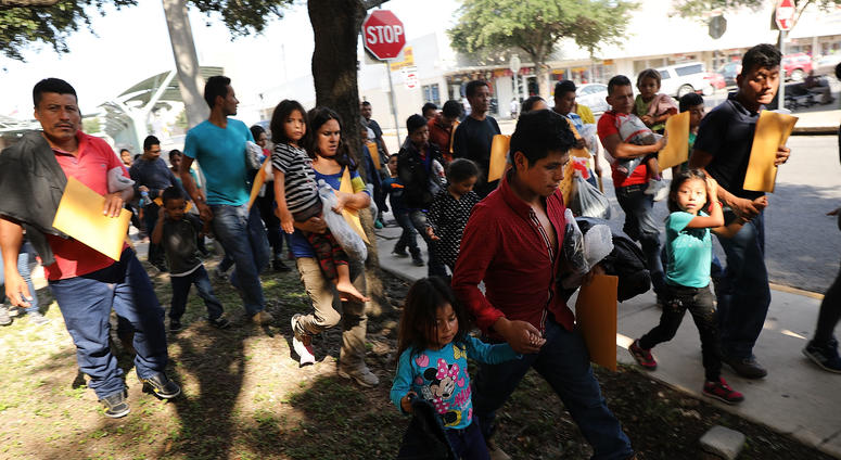 Dozens of women, men and their children, many fleeing poverty and violence in Honduras, Guatamala and El Salvador, arrive at a bus station following release from Customs and Border Protection on June 23, 2018 in McAllen, Texas. Dozens of women, men and their children, many fleeing poverty and violence in Honduras, Guatamala and El Salvador, arrive at a bus station following release from Customs and Border Protection on June 23, 2018 in McAllen, Texas.