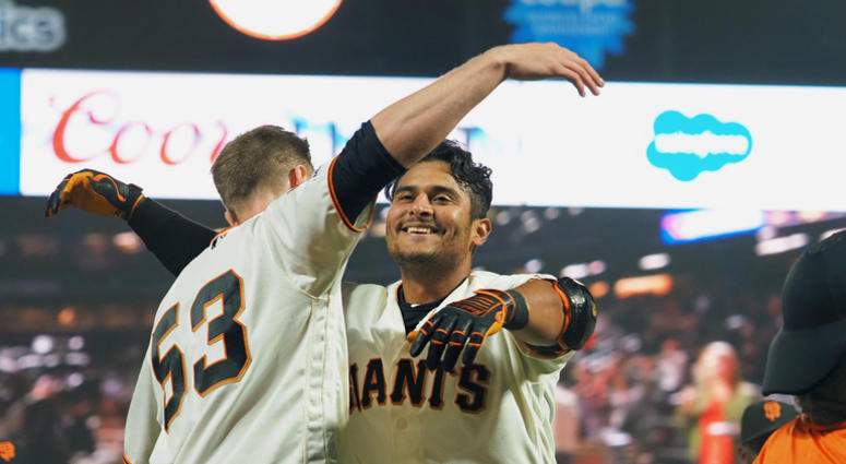 San Francisco Giants second baseman Donovan Solano (7) hugs right fielder Austin Slater (53) after hitting a walk-off single against the New York Mets during the sixteenth inning at Oracle Park on July 18, 2019. San Francisco Giants second baseman Donovan Solano (7) hugs right fielder Austin Slater (53) after hitting a walk-off single against the New York Mets during the sixteenth inning at Oracle Park on July 18, 2019.
