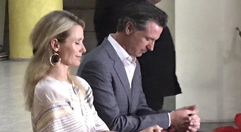 Governor Newsom and First Partner Jennifer Siebel Newsom pray at the tomb of Oscar Romero in San Salvador Governor Newsom and First Partner Jennifer Siebel Newsom pray at the tomb of Oscar Romero in San Salvador