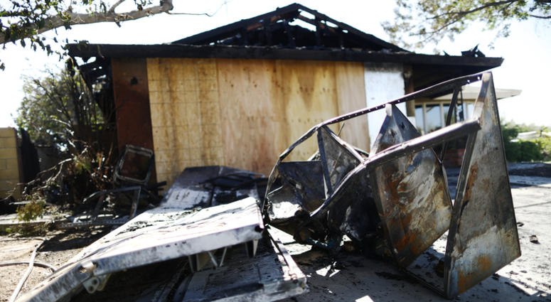 Ridgecrest, CA - July 4, 2019 Burned items sit in front of home that caught fire after a 6.4 magnitude earthquake. Home Charred By Fire After Ridgecrest Earthquake