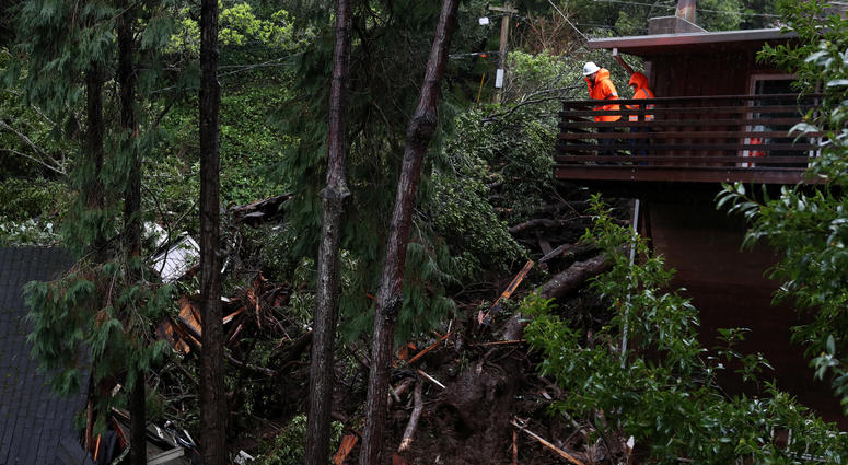 Sausalito, February 14, 2019 Workers look at whats left of a home that was swept down a hillside by a mudslide. Sausalito Mudslide