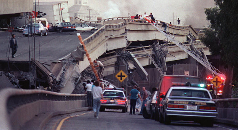 Rescue workers and police enter the scene of destruction where the Interstate 880-Interstate 80 interchange collapsed in Oakland during the Loma Prieta earthquake in October 1989. Rescue workers and police enter the scene of destruction where the Interstate 880-Interstate 80 interchange collapsed in Oakland during the Loma Prieta earthquake in October 1989.