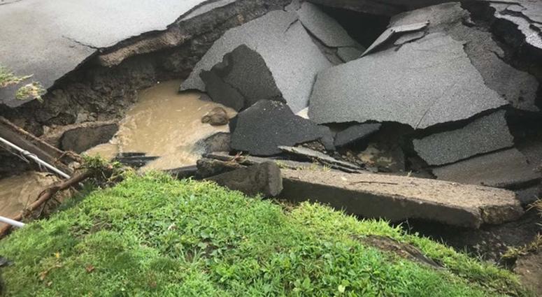 Heavy Rains Cause Sinkhole To Open Along McKnight Road Heavy Rains Cause Sinkhole To Open Along McKnight Road
