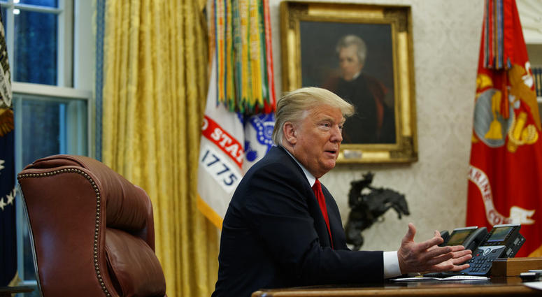 President Donald Trump speaks during an interview with The Associated Press in the Oval Office of the White House, Tuesday, Oct. 16, 2018, in Washington. DO NOT USE