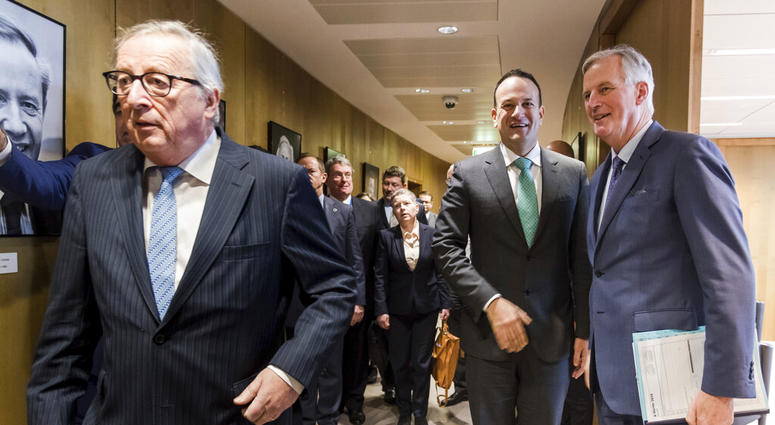 Irish Prime Minister Leo Varadkar, center, greets European Union chief Brexit negotiator Michel Barnier, right, as European Commission President Jean-Claude Juncker, left, walks by before their meeting at the European Commission headquarters in Brussels. DO NOT USE