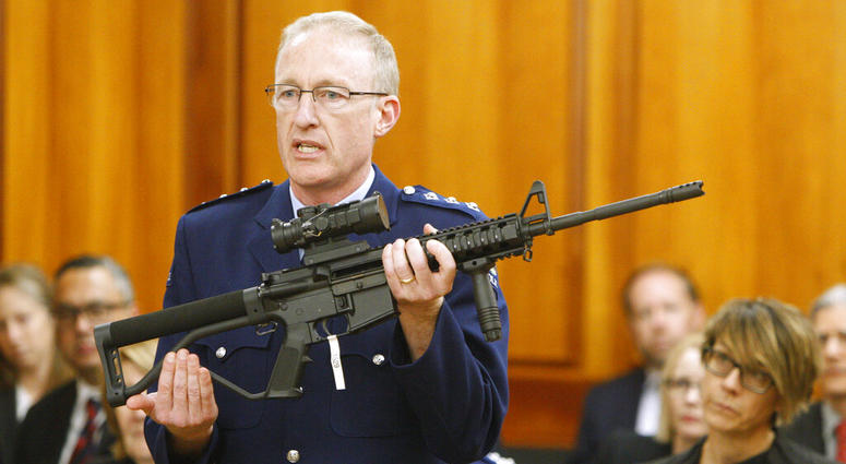 police acting superintendent Mike McIlraith shows New Zealand lawmakers an AR-15 style rifle AP DO NOT USE