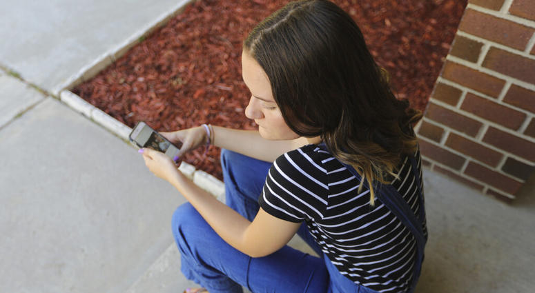 Rachel Whalen looks at her phone at her home in Draper, Utah AP DO NOT USE