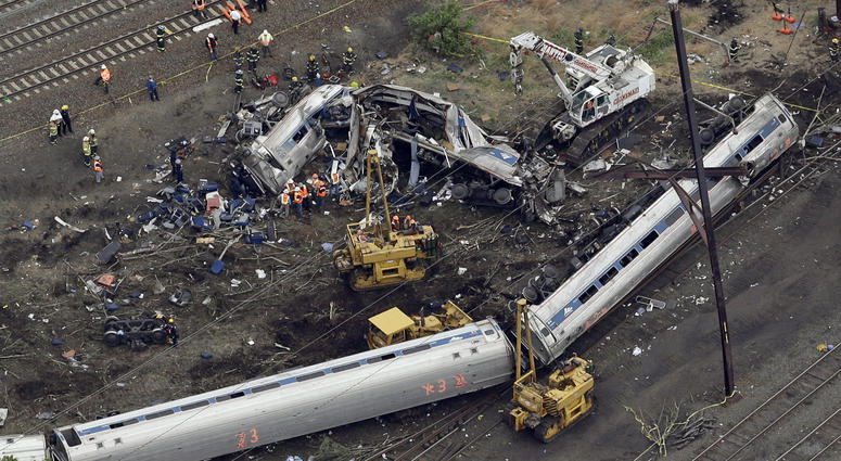 A New York City-bound Amtrak passenger train following a derailment that killed eight people and injured about 200 others in Philadelphia. A New York City-bound Amtrak passenger train following a derailment that killed eight people and injured about 200 others in Philadelphia.