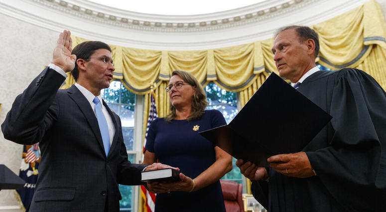 Mark Esper, left, is sworn in as the Secretary of Defense by Supreme Court Justice Samuel Alito, right Mark Esper, left, is sworn in as the Secretary of Defense by Supreme Court Justice Samuel Alito, right