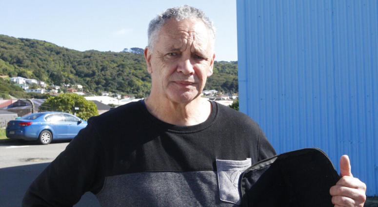 In this Aug. 31, 2019, photo, gun owner Phillip Fee poses holds his gun bag outside a temporary gun collection venue in Porirua, near Wellington, New Zealand. AP DO NOT USE