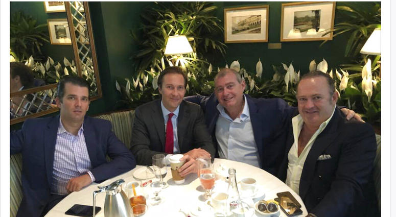 This Facebook screen shot provided by The Campaign Legal Center, shows from left, Donald Trump, Jr., Tommy Hicks, Jr., Lev Parnas and Igor Fruman, posted on May 21, 2018.