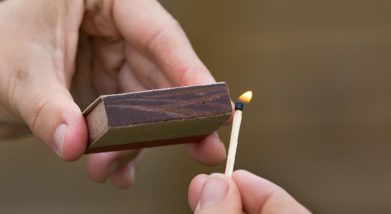 lighting a match