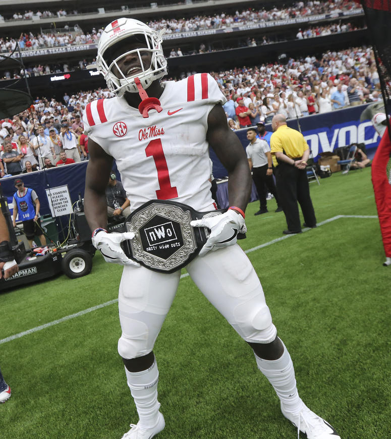 Mississippi wide receiver A. J. Brown displays the team's "Nasty Wide Outs" belt Mississippi wide receiver A. J. Brown displays the team's "Nasty Wide Outs" belt