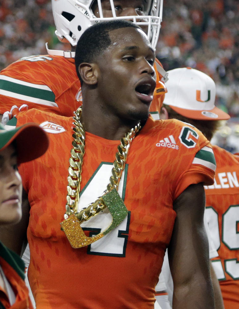 Miami defensive back Jaquan Johnson (4) wears the turnover chain Miami defensive back Jaquan Johnson (4) wears the turnover chain