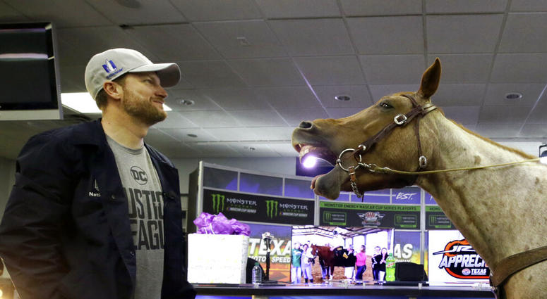 In this Nov. 3, 2017, file photo, Dale Earnhardt Jr., left, looks on as Eddie Gossage, president and CEO of Texas Motor Speedway, AP DO NOT USE