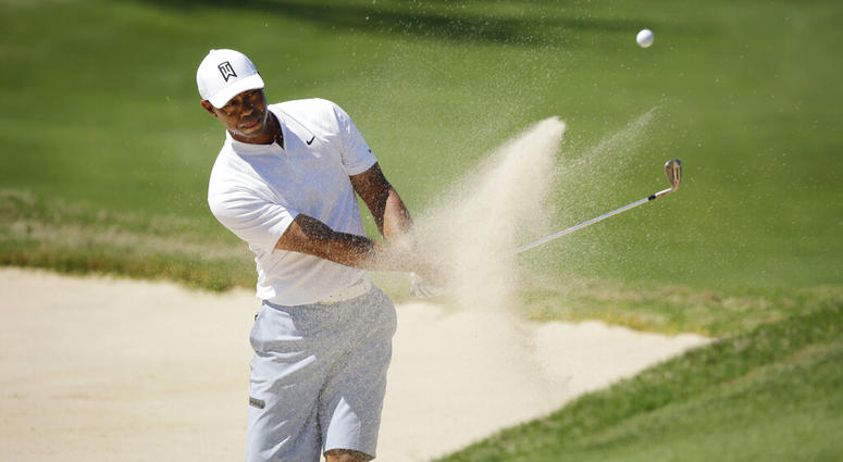 Tiger Woods plays a shot from a bunker on the 16th hole during a practice round at the Dell Match Play Championship golf tournament, Tuesday, March 26, 2019, in Austin, Texas. DO NOT USE