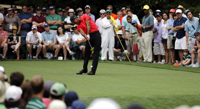 Tiger Woods tees off on the seventh hole during the fourth round of the Masters golf tournament, in Augusta, Ga. Woods goes into the Masters on April 11-14 trying to end 11 years without a major. AP DO NOT USE