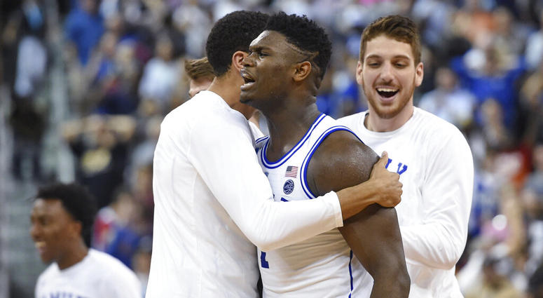 Duke's Zion Williamson, center, celebrates the team's 77-76 win over Central Florida in a second-round men's college basketball game in the NCAA Tournament in Columbia, S.C., Sunday, March 24, 2019. DO NOT USE
