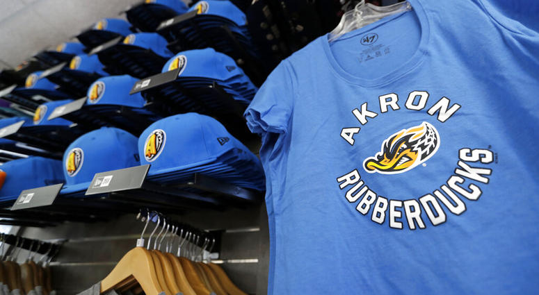 Akron RubberDucks logos show up on hat and shirt merchandise in the team shop before a minor league baseball game between Akron and Bowie, AP DO NOT USE