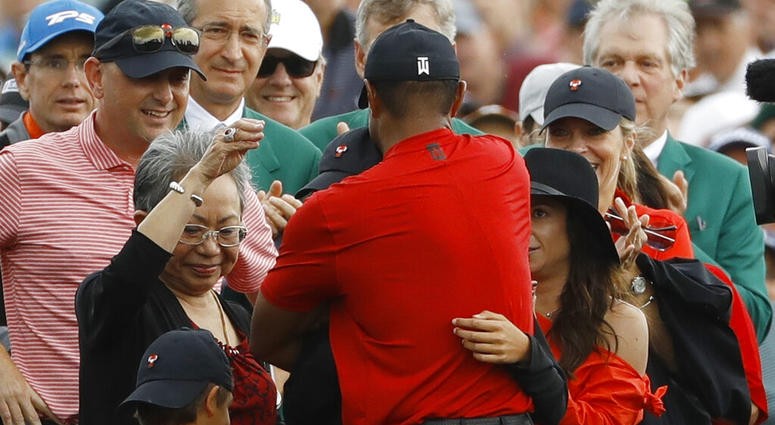 Tiger Woods hugs his family after winning the Masters golf tournament Sunday, April 14, 2019, in Augusta, Ga. AP DO NOT USE
