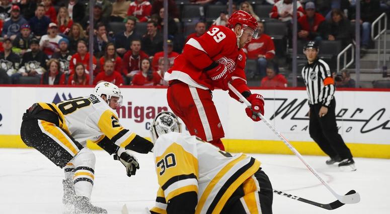 Detroit Red Wings right wing Anthony Mantha (39) shoots the puck past Pittsburgh Penguins goaltender Matt Murray for a goal during the third period of an NHL hockey game, Tuesday, April 2, 2019, in Detroit. DO NOT USE