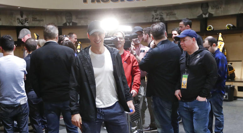 Pittsburgh Penguins' Sidney Crosby walks from reporters after talking with them in the practice facility locker room before leaving for the off season two days after being swept by the New York Islanders in the first round of the NHL hockey playoffs, Thur Pittsburgh Penguins' Sidney Crosby walks from reporters after talking with them in the practice facility locker room before leaving for the off season two days after being swept by the New York Islanders in the first round of the NHL hockey playoffs, Thur