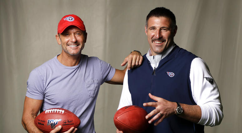 photo, country music star Tim McGraw, left, poses with Tennessee Titans head coach Mike Vrabel in Nashville, Tenn. After the opening round of the NFL Draft in Nashville on Friday, April 25, McGraw will cap off the evening performing on the draft stage AP DO NOT USE