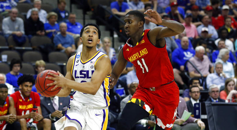 LSU's Tremont Waters, left, goes to the basket past Maryland's Darryl Morsell (11) during the first half of a second-round game in the NCAA men’s college basketball tournament in Jacksonville, Fla., Saturday, March 23, 2019 LSU's Tremont Waters, left, goes to the basket past Maryland's Darryl Morsell (11) during the first half of a second-round game in the NCAA men’s college basketball tournament in Jacksonville, Fla., Saturday, March 23, 2019